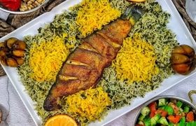 طرز تهیه سبزی پلو با ماهی قزل‌آلا برای شب عید؛ روش طعم دار کردن متفاوت ماهی