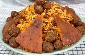 طرز تهیه گردو پلو ؛ غذای مجلسی شهر کرد
